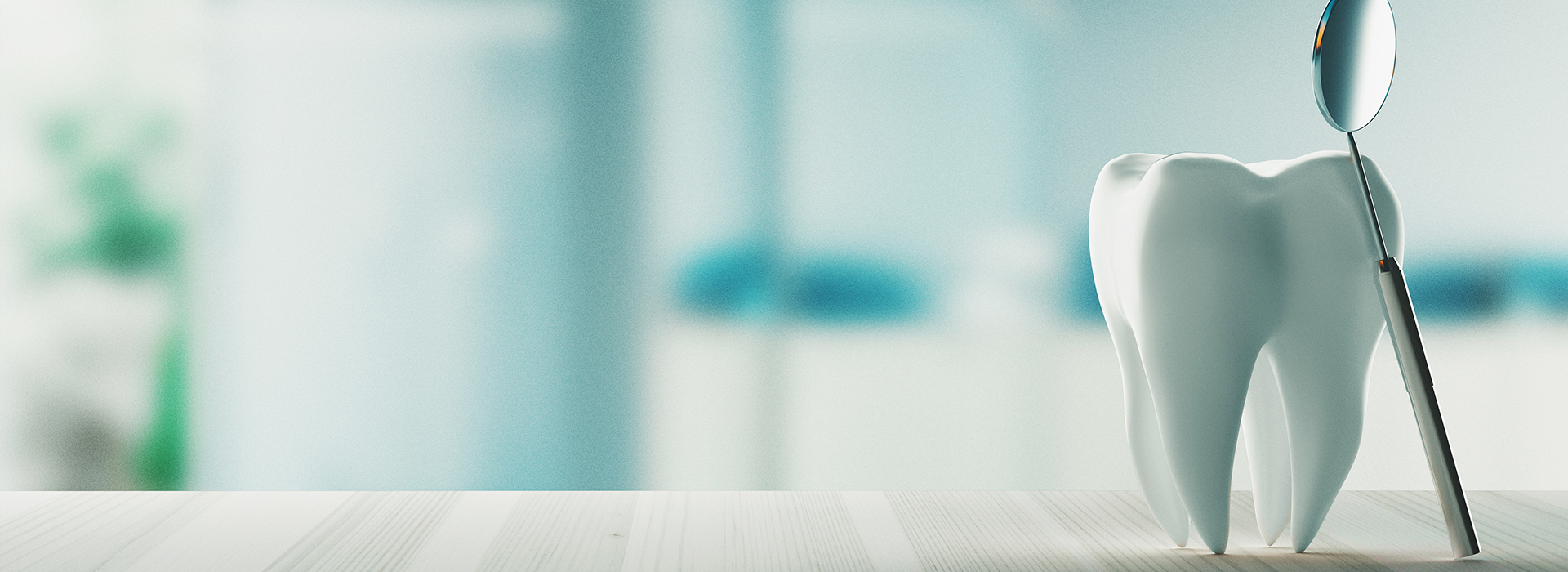 The image is a photograph of a dental office with a focus on a toothbrush and a cup, taken from an angle that obscures the details of the room.